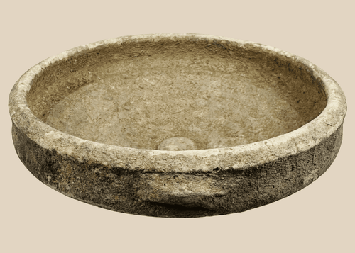 Authentic Roman North African terracotta bowl dating to the Roman Imperial Period, featuring a broad shallow form with traces of white slip.