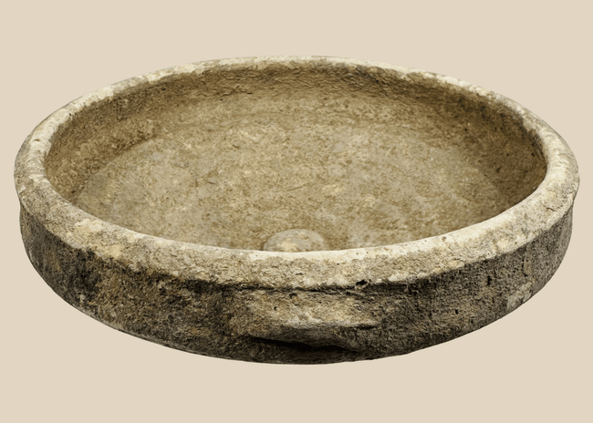 Authentic Roman North African terracotta bowl dating to the Roman Imperial Period, featuring a broad shallow form with traces of white slip.