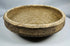 Side profile of a Roman North African pottery bowl illustrating its thickened rim and gently sloping walls.