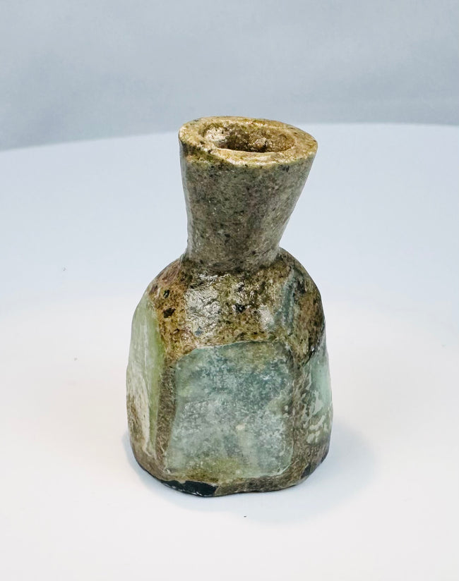 Roman glass cosmetic or medicinal vessel with pale blue-green colouring