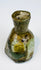Small Roman Imperial glass perfume bottle dating to the 1st–3rd century CE
