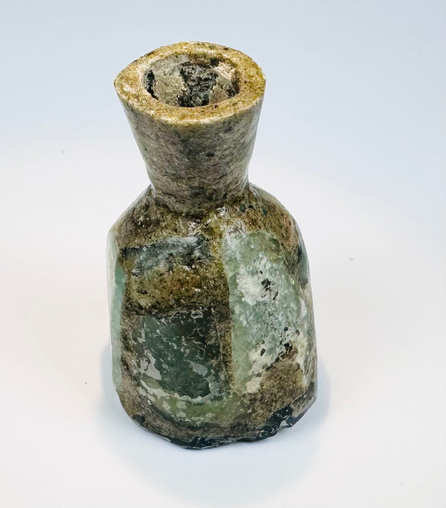 Eastern Mediterranean Roman glass bottle with brown-gold weathering and clouding