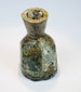 Eastern Mediterranean Roman glass bottle with brown-gold weathering and clouding