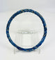 Ancient Roman glass bracelet photographed with visible iridescent sheen and smooth rounded edges.