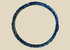 Ancient Roman glass bracelet with cobalt-blue hue, twisted design, and iridescent patina from antiquity.