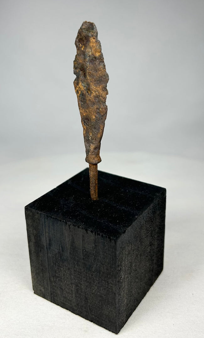 Roman to early medieval iron weapon point showing natural patina and surface encrustation