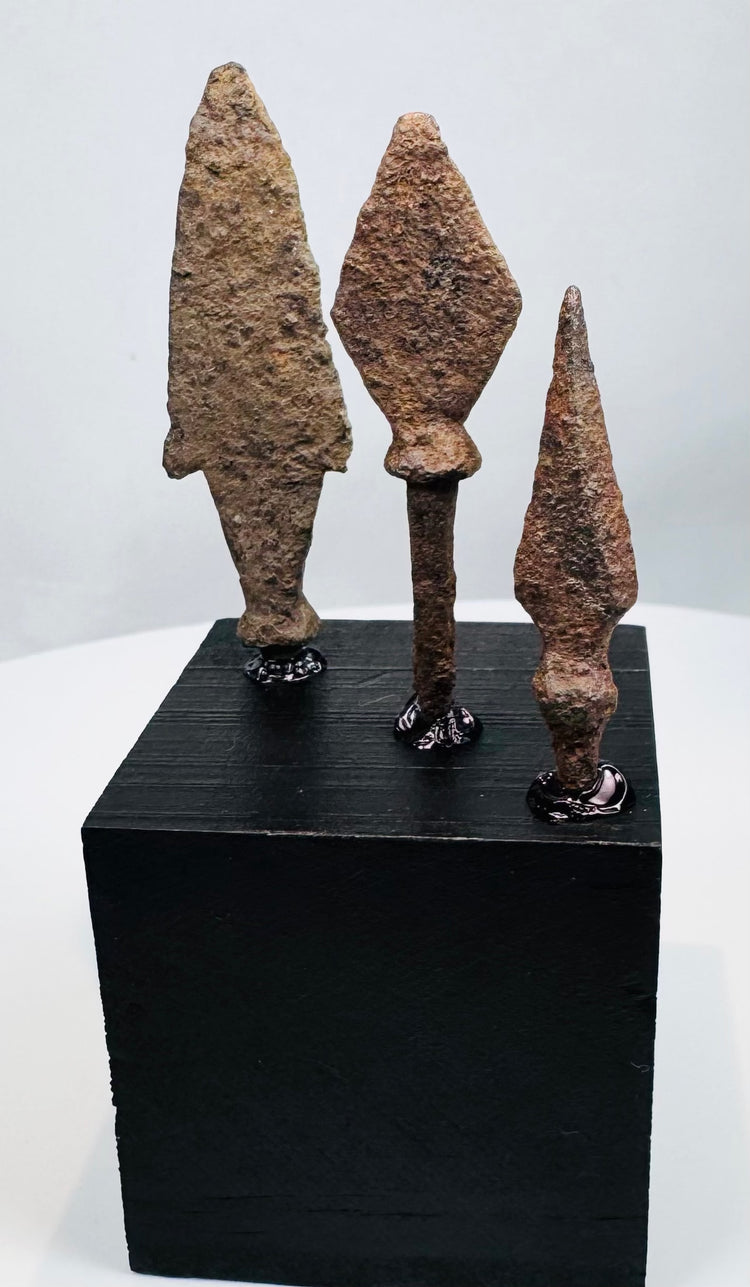 Broad leaf-shaped medieval iron projectile point with long rectangular tang