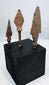 Three European iron weapon points in elongated, leaf-shaped, and triangular forms