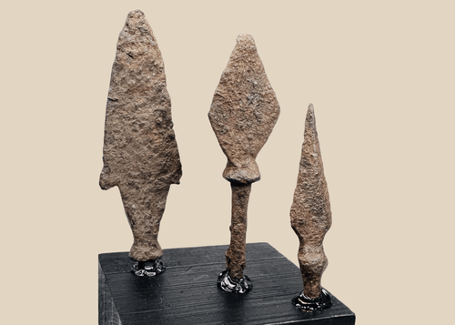 Group of three ancient Roman to medieval iron projectile points on black display bases