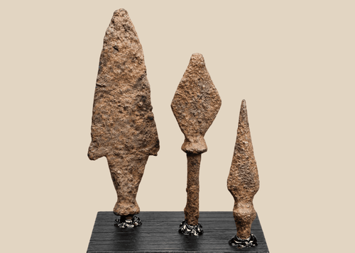 Group of three ancient Roman to medieval iron projectile points on black display bases