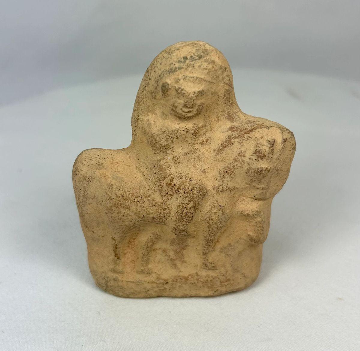 Terracotta figurine from Roman Egypt, 1st–3rd century CE, depicting a horse with strong proportions and a rider in a commanding pose, blending Roman and Egyptian artistic traditions.