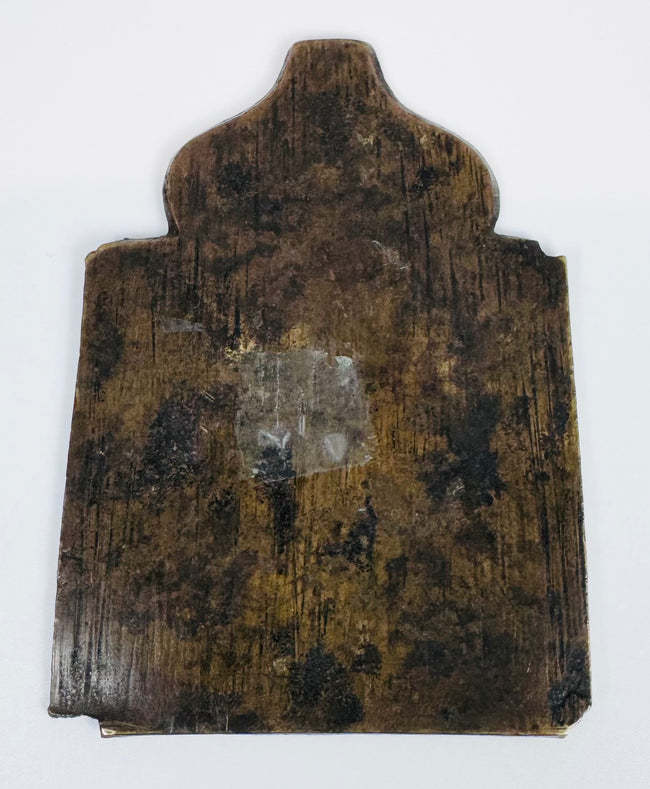 Nineteenth-century Russian Orthodox bronze icon with haloed saints, decorative motifs, and devotional significance.