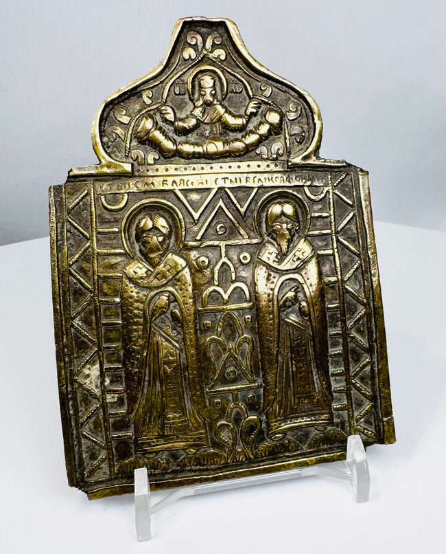 Antique Russian folding icon center section featuring Saints Blaise and Athanasius in traditional Orthodox iconography.