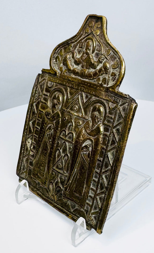 Historic Russian Orthodox devotional icon cast in bronze with traces of enamel and richly detailed religious imagery.