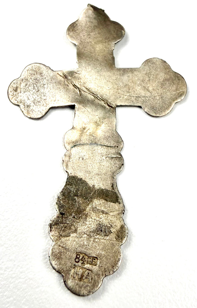 Reverse side of 84 standard silver cross showing maker's initials HA and wear marks