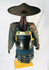 Authentic Japanese samurai armor from the Muromachi Period (1333–1573), featuring black-lacquered cuirass with gold accents, kote sleeves with chainmail reinforcement, dark-blue silk lacing, and a lacquered jingasa war hat bearing the Takeda clan crest, displayed on a wooden stand against a white background