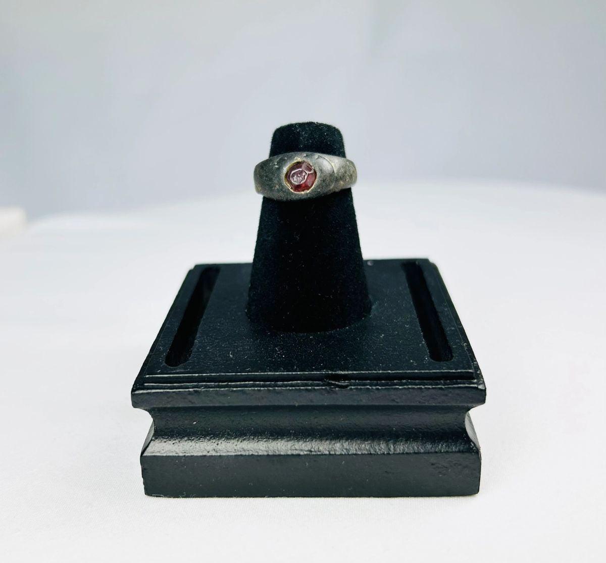 Ancient Sassanian silver ring with polished carnelian intaglio gemstone featuring engraved design, circa 224–651 CE, used as both personal adornment and functional seal.