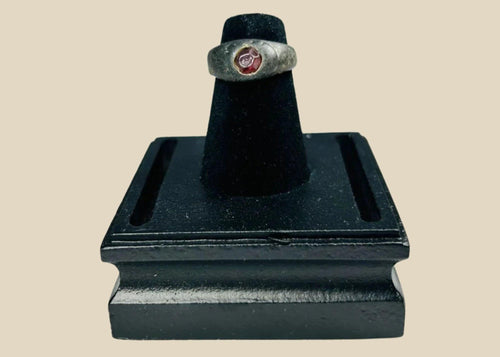 Ancient Sassanian silver ring with polished carnelian intaglio gemstone featuring engraved design, circa 224–651 CE, used as both personal adornment and functional seal.