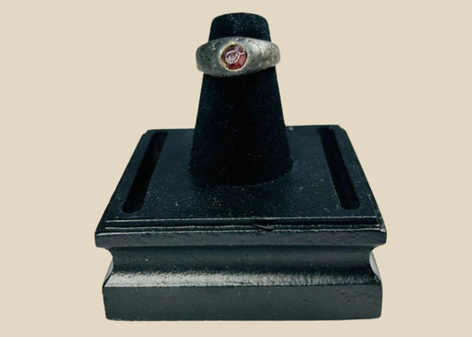 Ancient Sassanian silver ring with polished carnelian intaglio gemstone featuring engraved design, circa 224–651 CE, used as both personal adornment and functional seal.