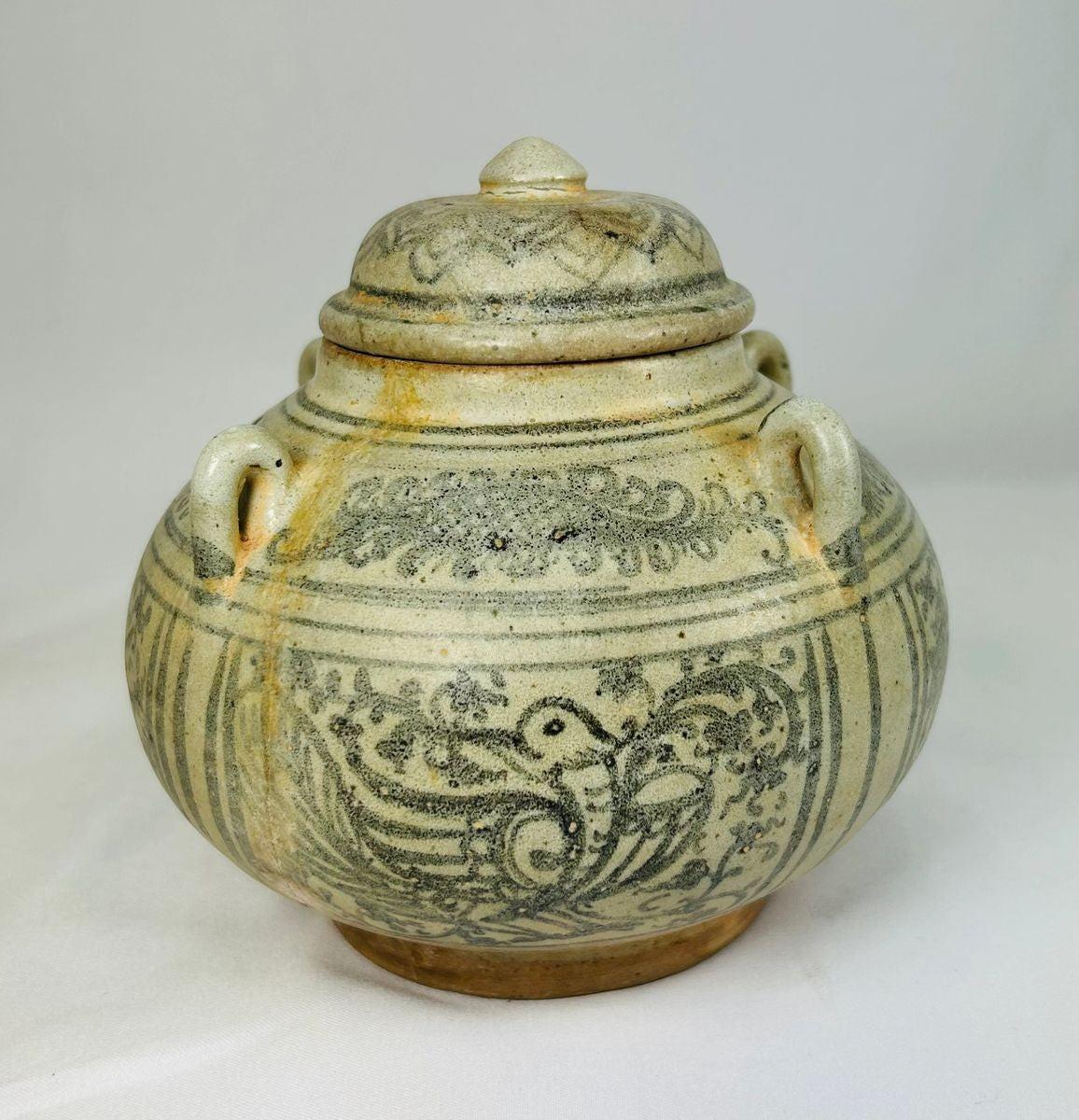 Sawankhalok glazed stoneware bowl from Thailand, 14th–16th century CE. Features dark underglaze decoration with birds, beasts, and floral motifs. Rounded form with smooth glaze, reflecting Sukhothai-era craftsmanship and Southeast Asian cultural influences. Excellent preserved condition with minor age wear.