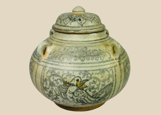 Sawankhalok glazed stoneware bowl from Thailand, 14th–16th century CE. Features dark underglaze decoration with birds, beasts, and floral motifs. Rounded form with smooth glaze, reflecting Sukhothai-era craftsmanship and Southeast Asian cultural influences. Excellent preserved condition with minor age wear.