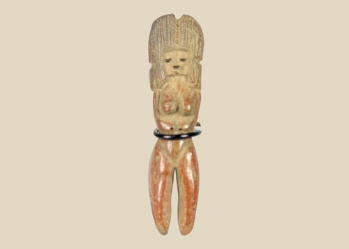 Molded terracotta figurine of seated female from Classic Veracruz culture, with vertical ridged headdress, bent legs, hands raised to face, incised facial features, and traces of red slip; mounted on black display stand; circa 600–900 CE, Gulf Coast of Mexico.