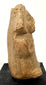 Side profile of Pre-Columbian terracotta seated woman with flaring headdress