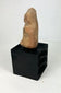 Veracruz terracotta ritual figurine with stylized facial features and compact seated form