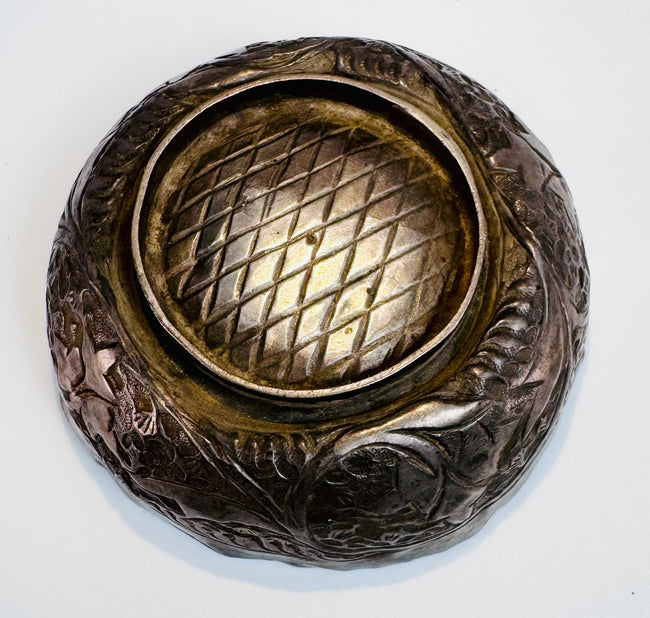 Medieval Islamic metalwork bowl from Persia with delicate engraved ornamentation reflecting Seljuk artistic craftsmanship.