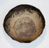 Interior of a Seljuk silver bowl showing natural oxidation, surface wear, and preserved hand-forged construction.