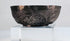 Small Persian silver bowl from the Seljuk period, traditionally associated with storing precious oils, ointments, or perfumes.