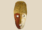 Papua New Guinea Sepik River tribal mask, hand-carved hardwood with red ochre and lime pigments, dual-colored face, circa 1900–1940.