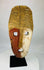 Hand-carved Sepik River mask with red ochre and lime pigments
