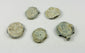 Five historic lead trade seals with marine patina and encrustation from prolonged underwater exposure
