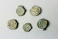 Shipwreck-recovered lead bag or bale seals with traces of impressed commercial markings