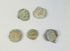 Marine-encrusted lead seals once used to identify bags and bales of traded goods