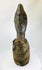 African wooden figure from Central or West Africa, carved with long facial features and traces of pigments