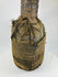 Wooden anthropomorphic figure from Central or West Africa with fiber torso wrapping and carved details