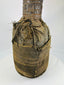 Wooden anthropomorphic figure from Central or West Africa with fiber torso wrapping and carved details