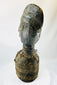 Central or West African carved wooden figure with elongated face and preserved decorative fibers