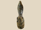 Hand-carved Central or West African wooden figure with elongated facial features, natural fiber torso wrapping, and traces of organic pigments, standing on a white background.