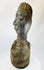 Traditional West African wooden figure, hand-carved with elongated features and organic pigment traces