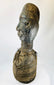 Traditional West African wooden figure, hand-carved with elongated features and organic pigment traces