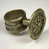 Late 19th-century antique ring with floral relief centerpiece and softly aged silver surface