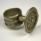 Late 19th-century antique ring with floral relief centerpiece and softly aged silver surface