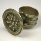 Victorian-era silver-toned finger ring with embossed rosette motif and tapered intact band