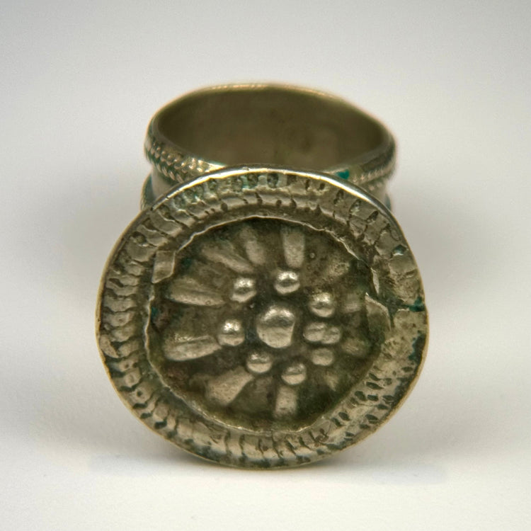 Late 19th-century European silver-toned ring with circular rosette bezel and fine beaded border