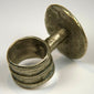 Late Victorian finger ring with raised rosette decoration and gently tapered silver-toned band