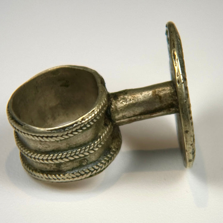 Antique European floral ring with crisp relief design and subtle dark oxidation around the bezel