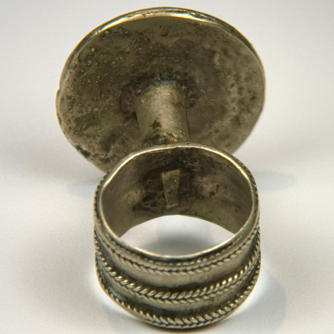 European silver-colored ring from the late 19th century with raised botanical motif and tapered shank